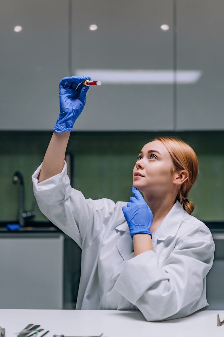 Lab technician inspecting a blood sample